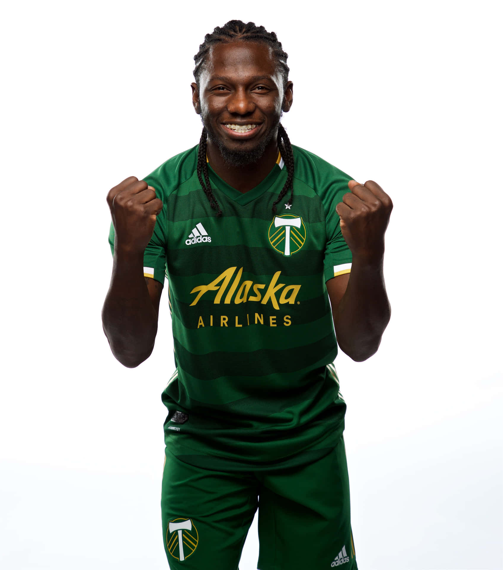 Soccer_ Player_ Celebratory_ Pose_ Portland_ Timbers Background