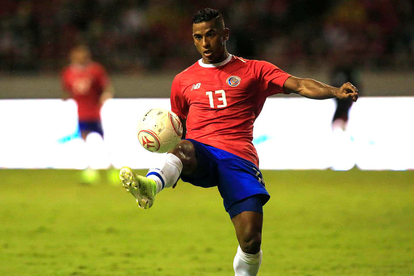 Soccer_ Player_ Controling_ Ball_ Midgame.jpg Background