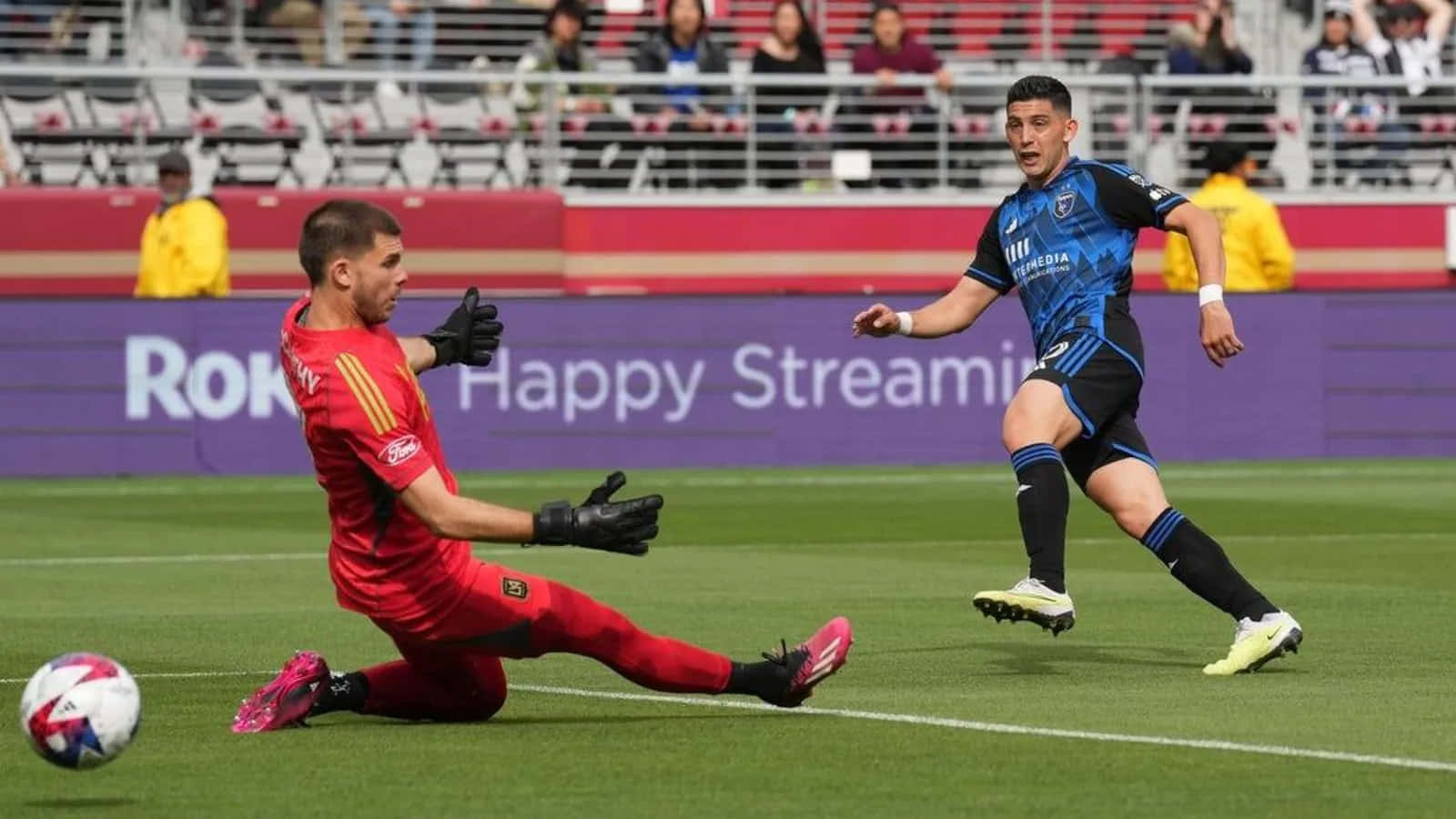 Soccer Player Espinoza Dribbling Past Goalkeeper Background