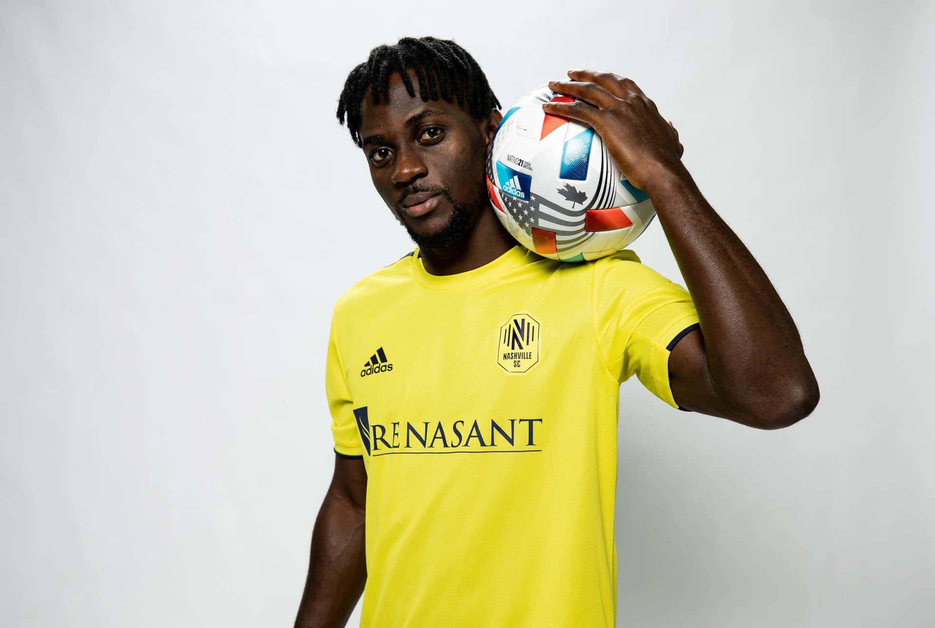 Soccer_ Player_ Holding_ Ball Background