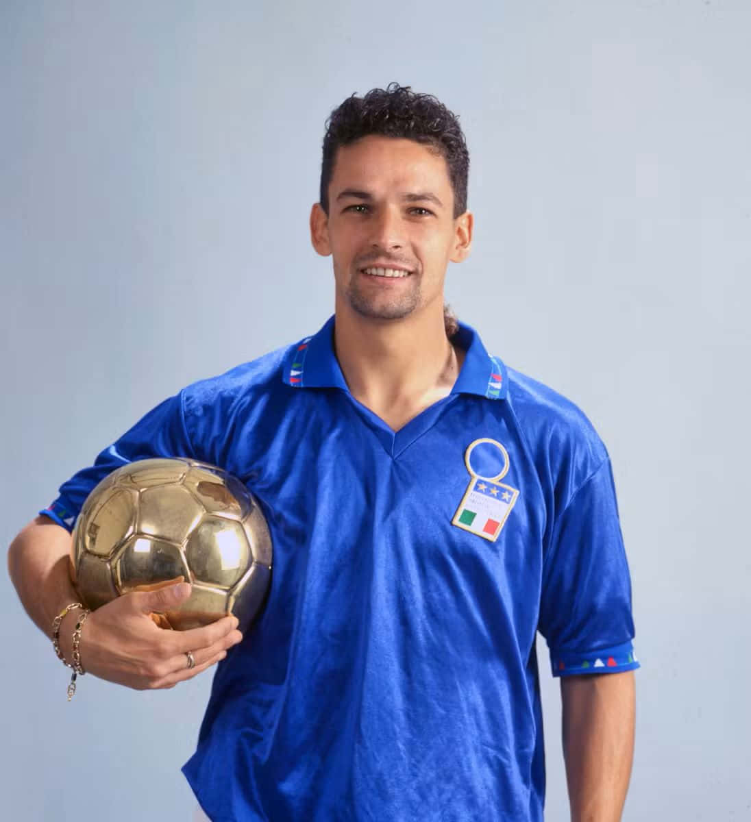 Soccer Player Holding Golden Ball Background