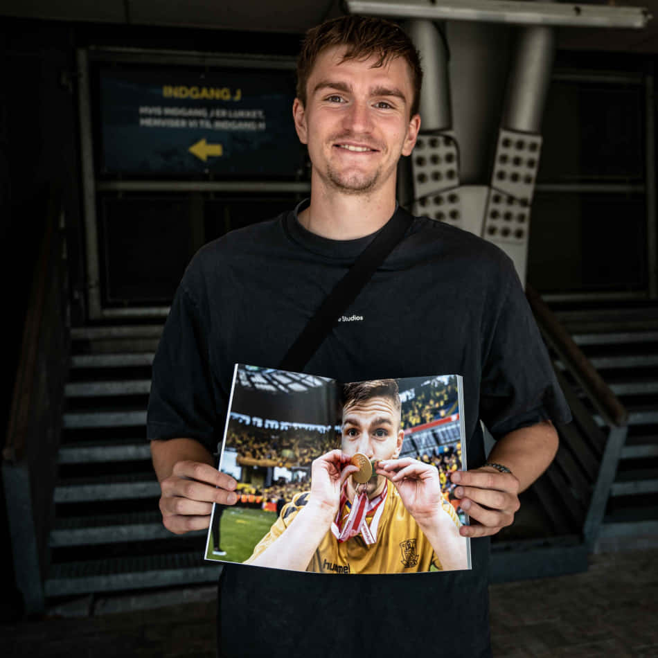 Soccer Player Holding Photo Background