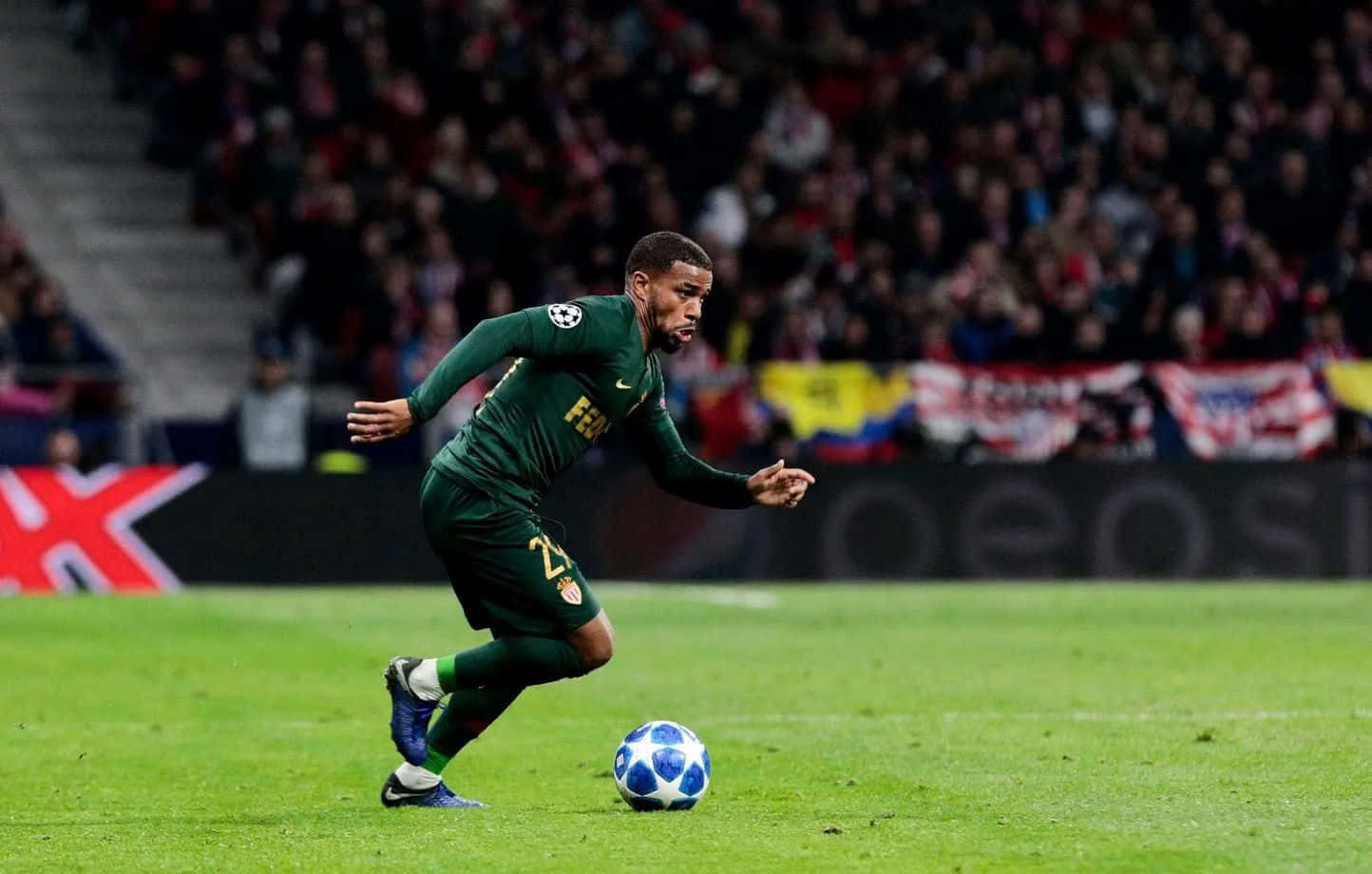 Soccer_ Player_in_ Action_ Dribbling Background