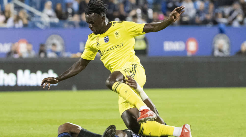 Soccer_ Player_in_ Action_ During_ Match.jpg Background