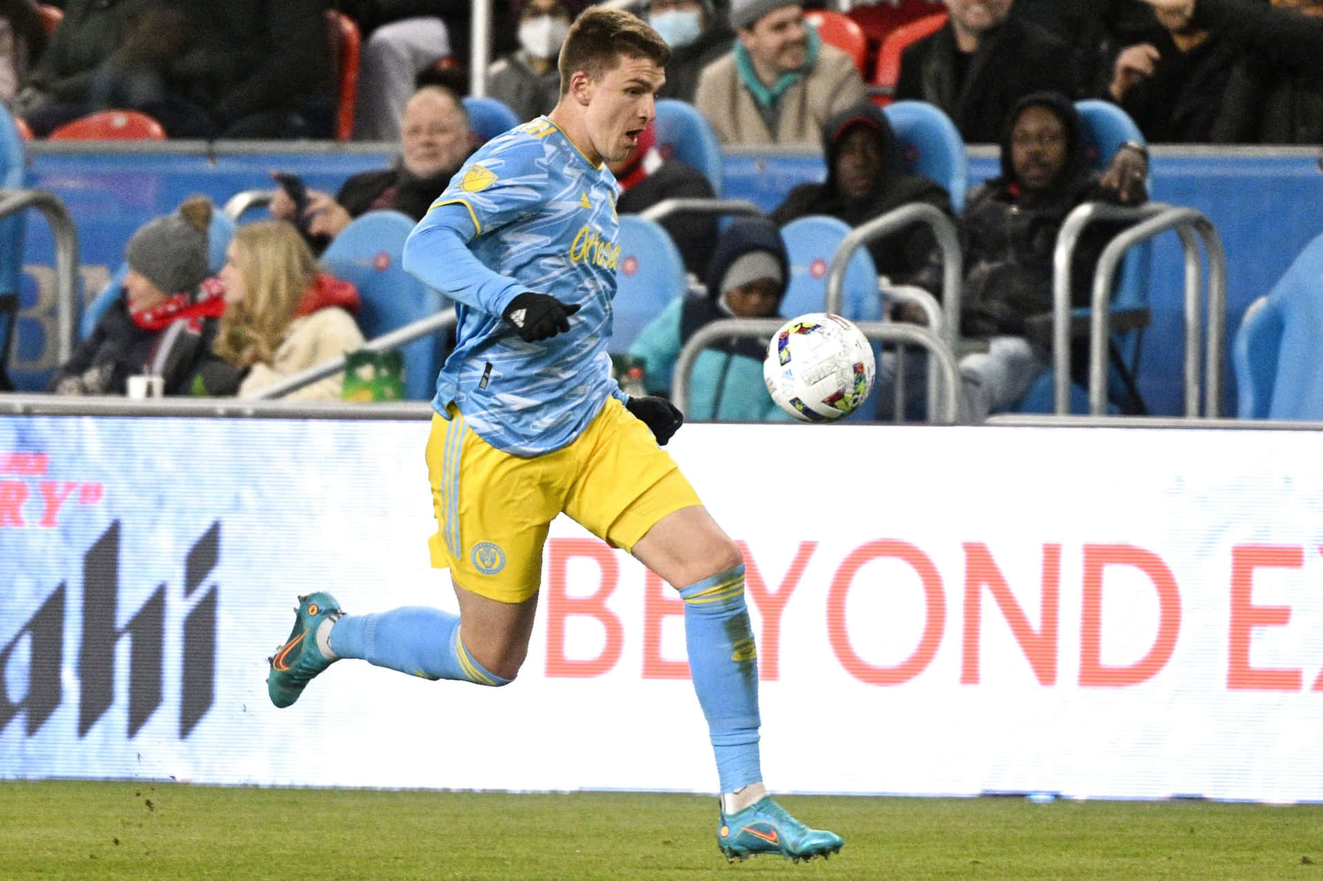 Soccer_ Player_in_ Action_ During_ Match.jpg Background