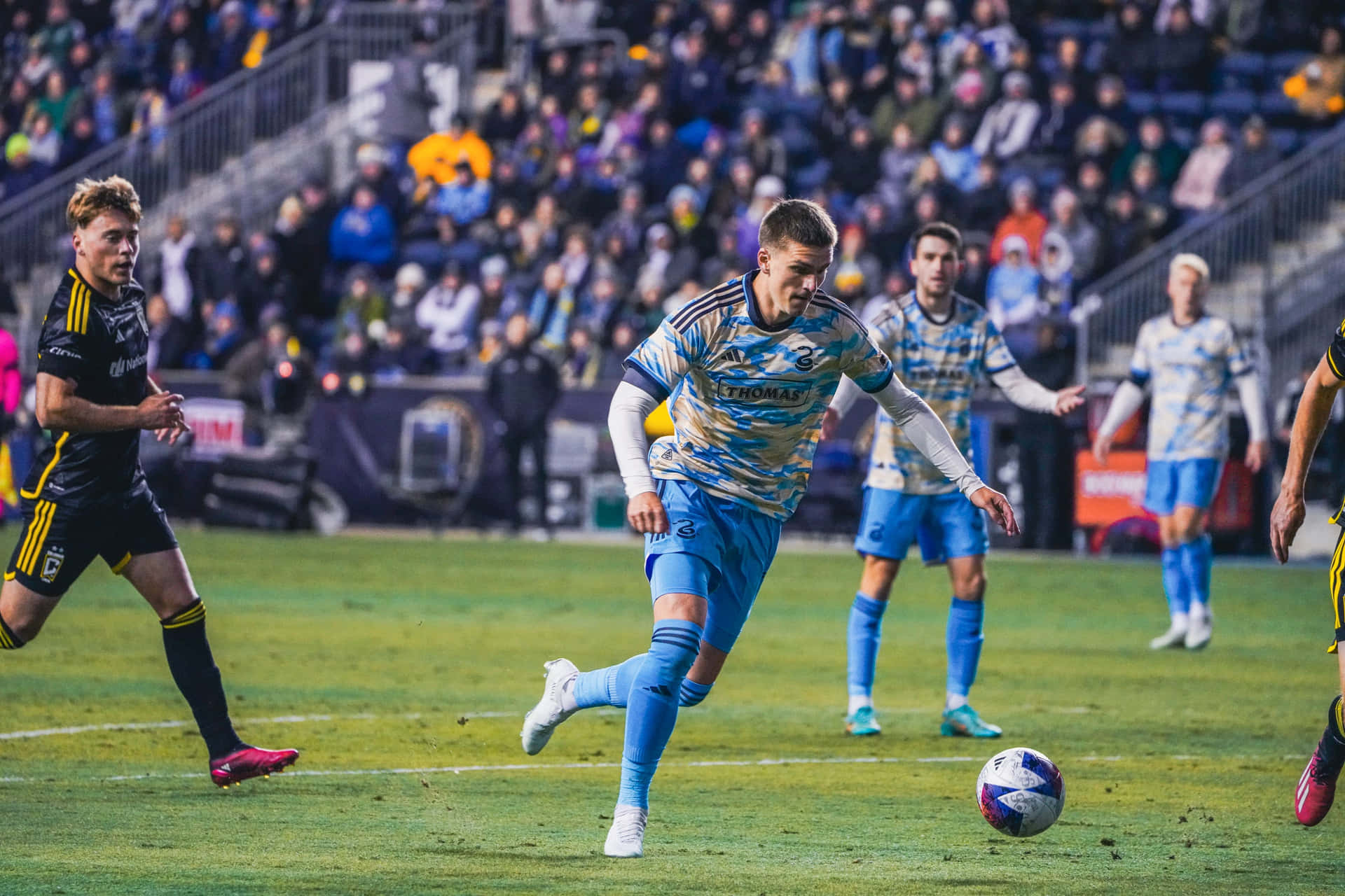 Soccer_ Player_in_ Action_ During_ Match Background