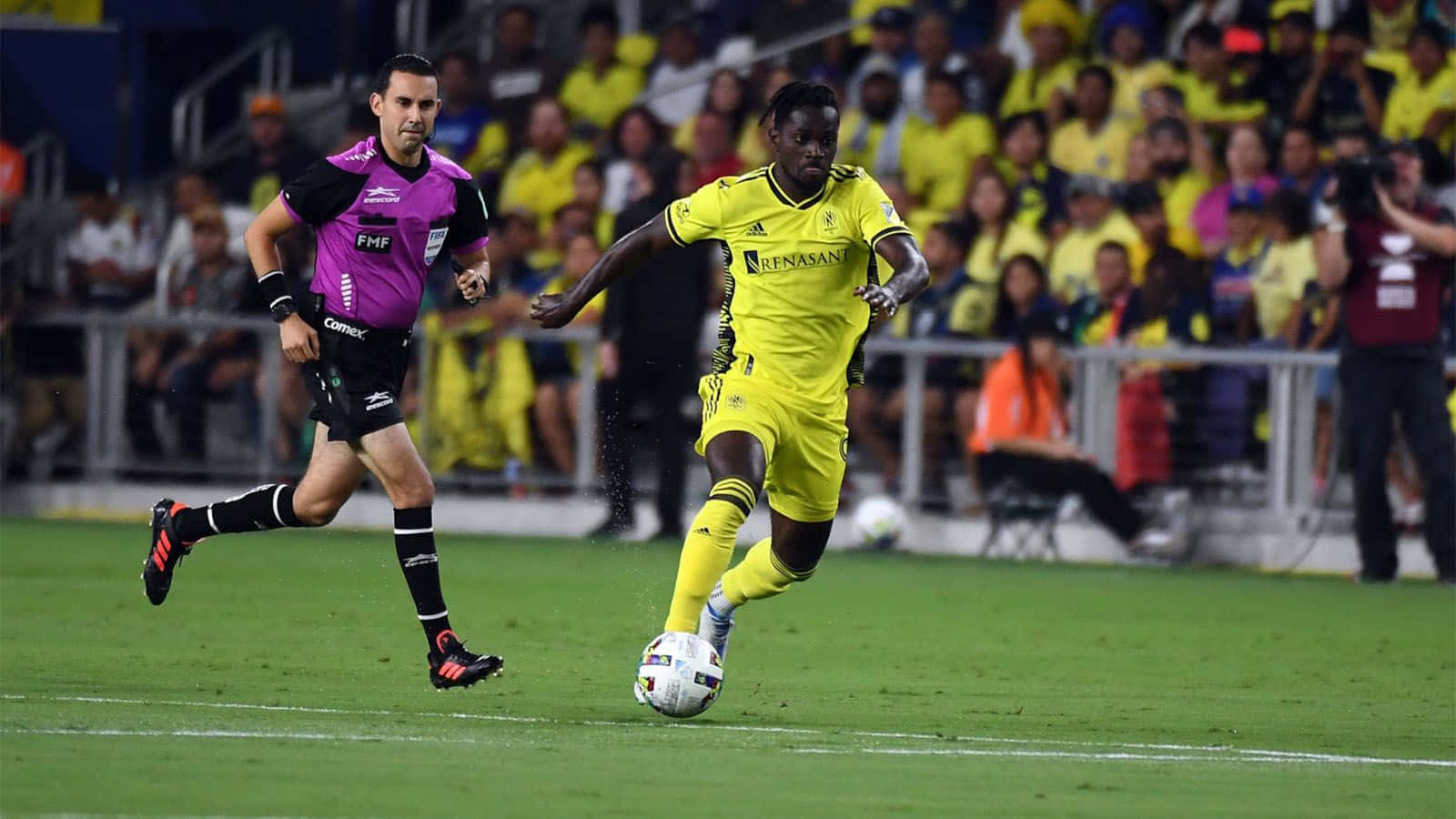 Soccer_ Player_in_ Action_ During_ Match Background