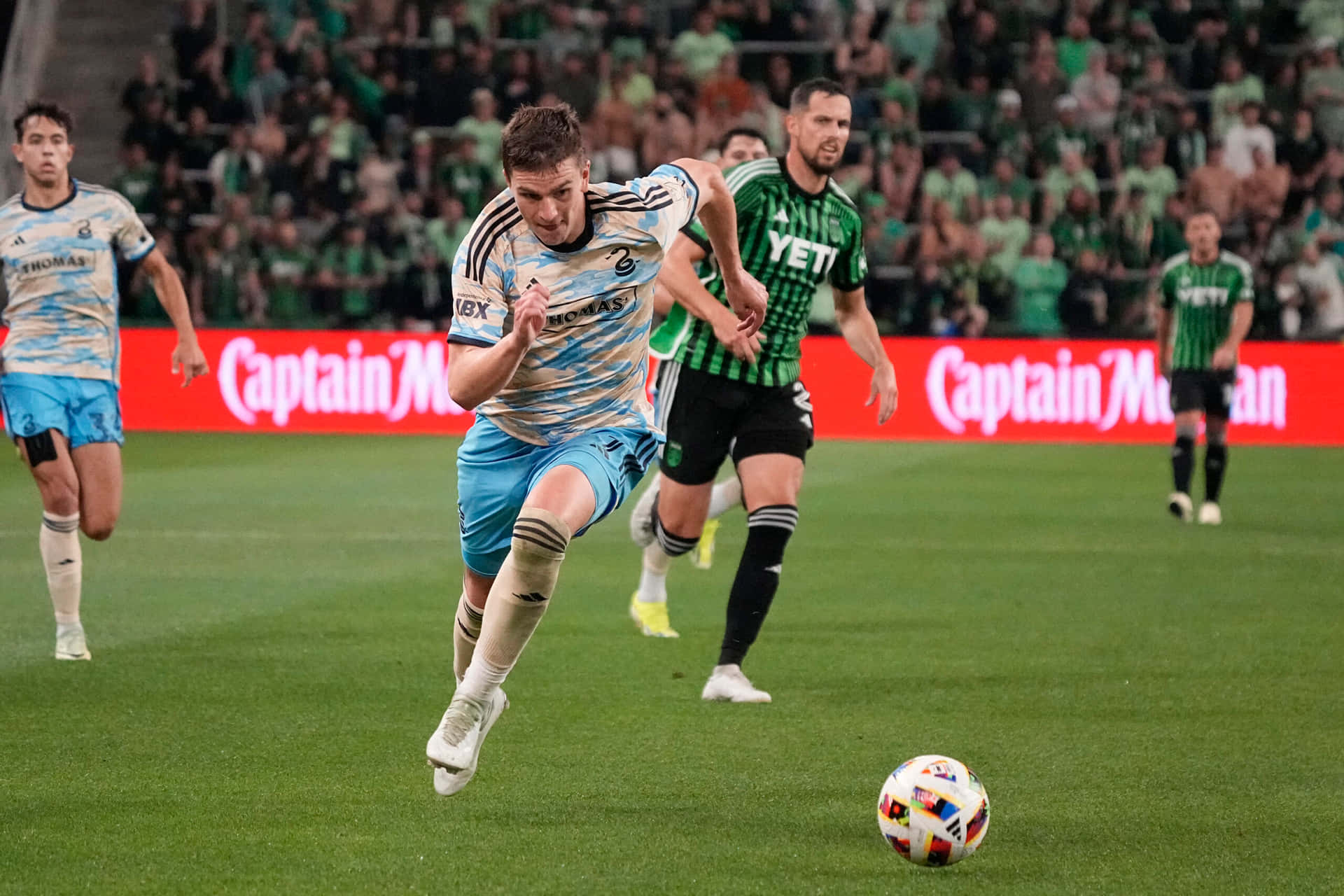 Soccer_ Player_in_ Action_ During_ Match Background