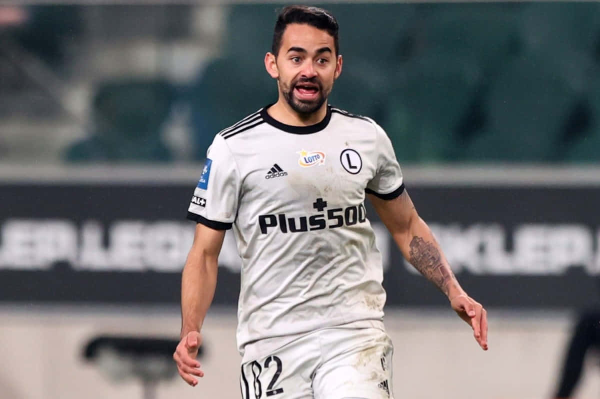 Soccer Player In Action During Match Background