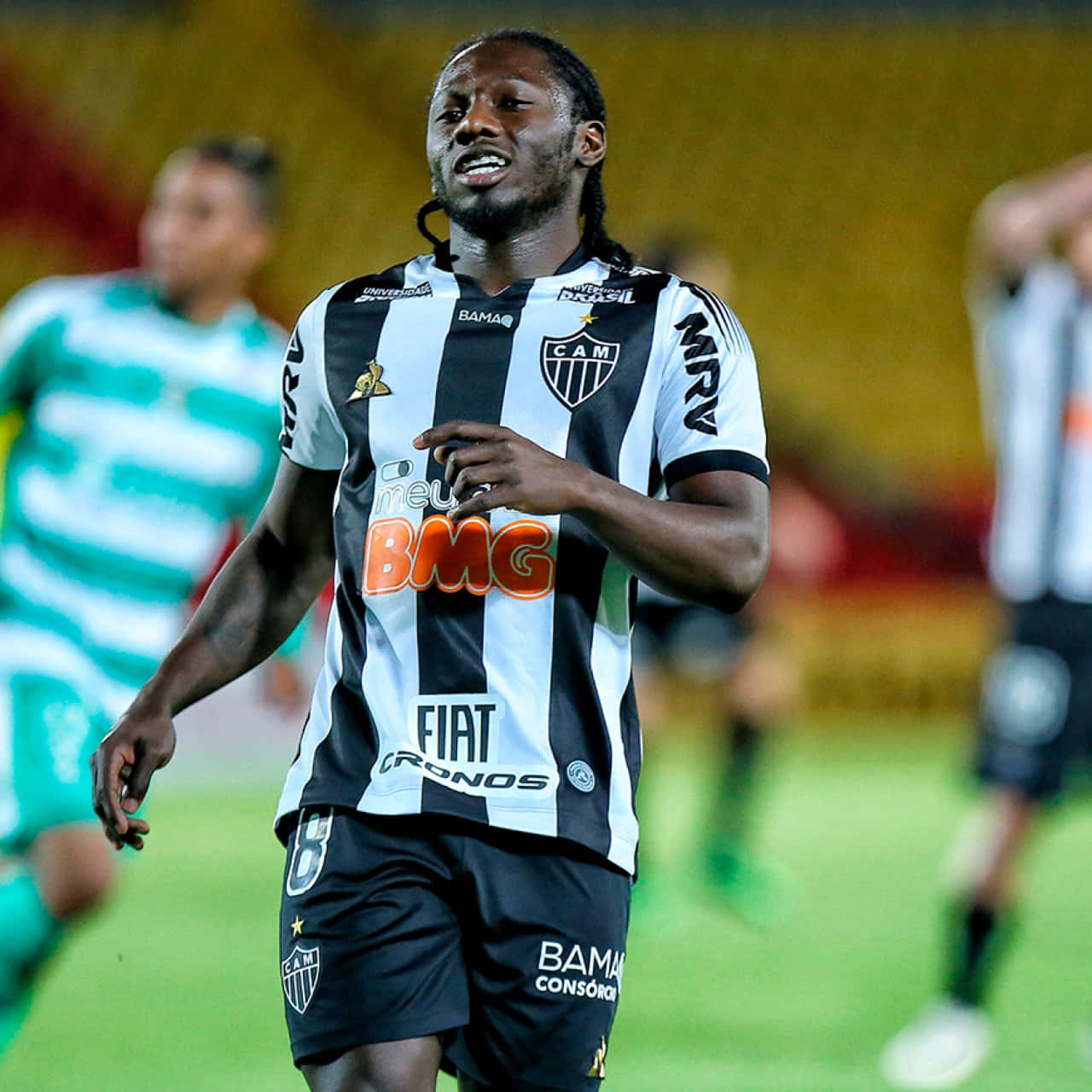 Soccer_ Player_in_ Action_on_ Field Background