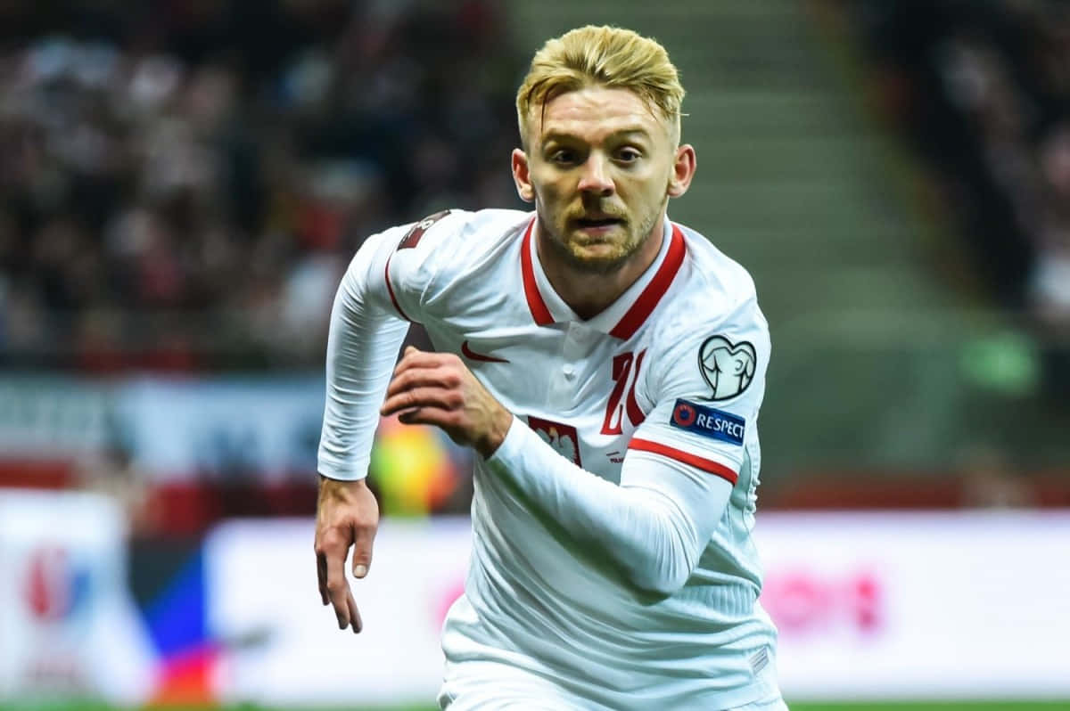 Soccer_ Player_ In_ Action_ On_ Field Background
