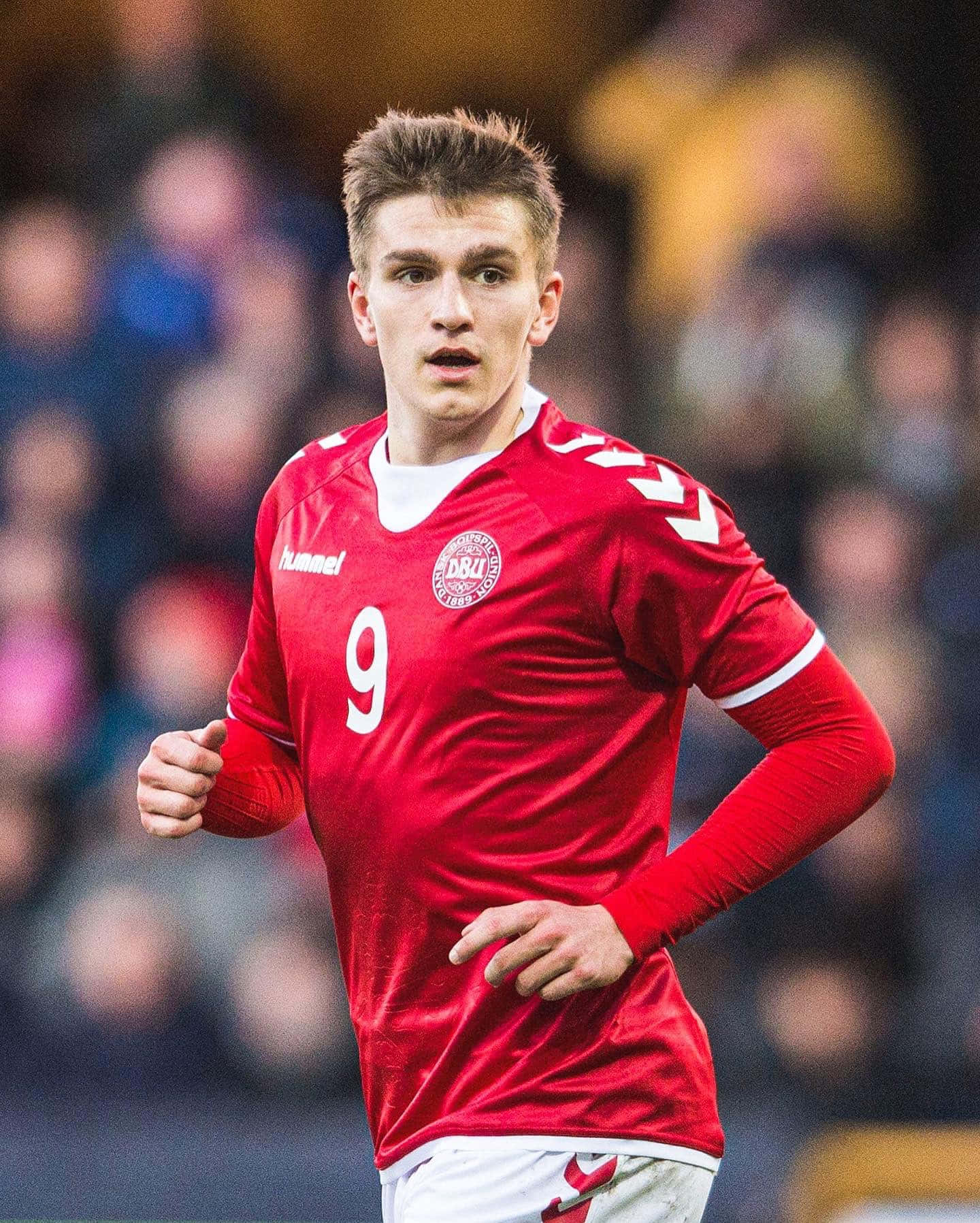 Soccer_ Player_in_ Red_ Jersey_ Number_9 Background