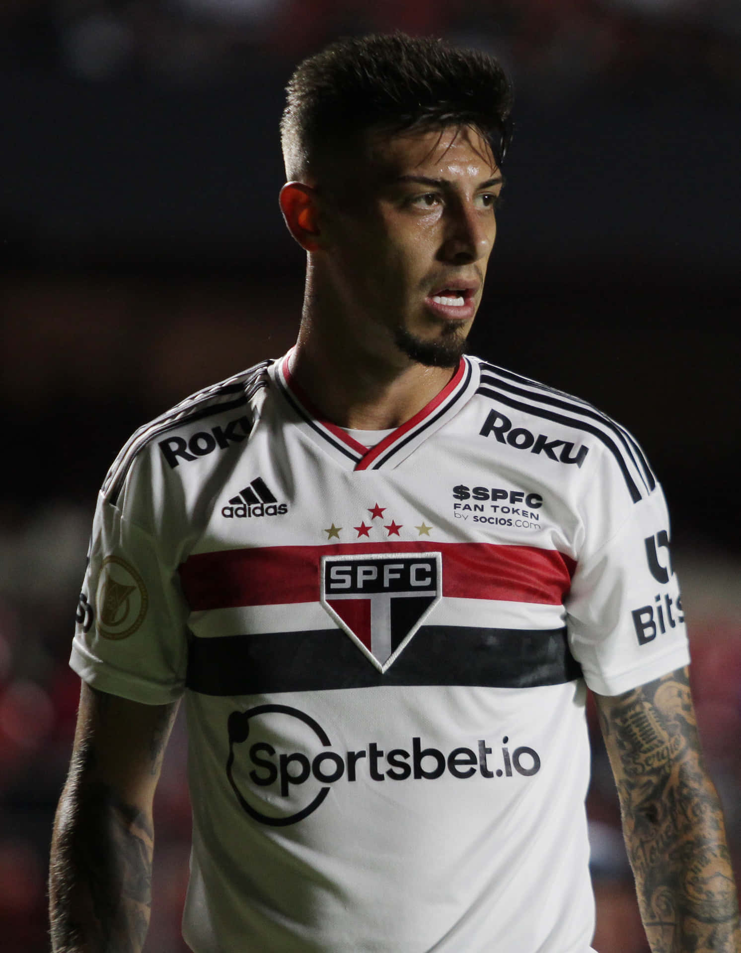 Soccer_ Player_in_ White_ Jersey Background