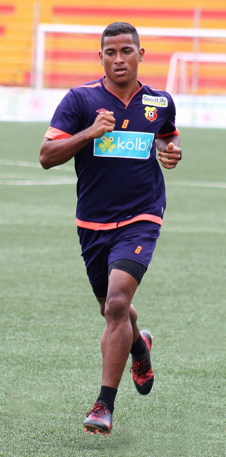 Soccer_ Player_ Jogging_ During_ Training_ Session Background