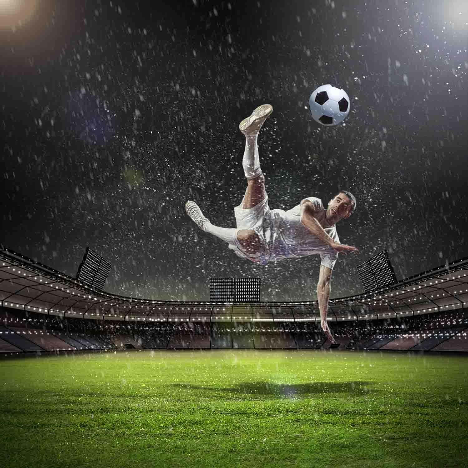 Soccer Player Kicking A Soccer Ball In The Rain Background