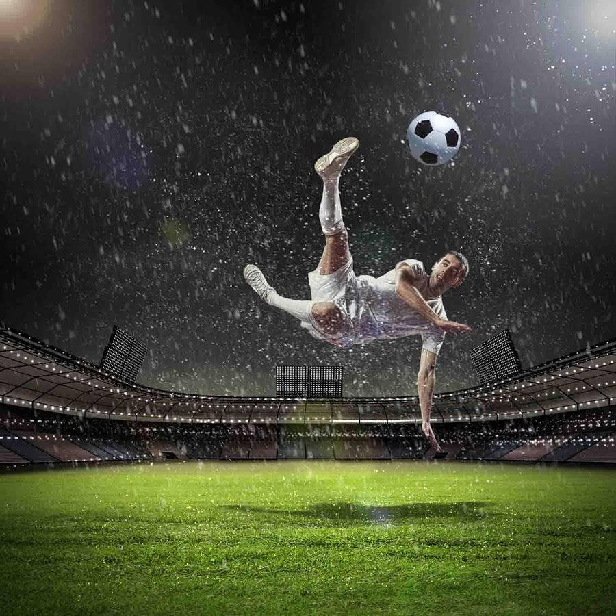 Soccer Player Kicking The Ball