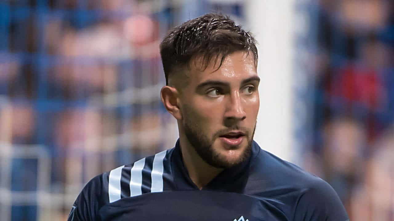 Soccer Player Lucas Cavallini In Action Background