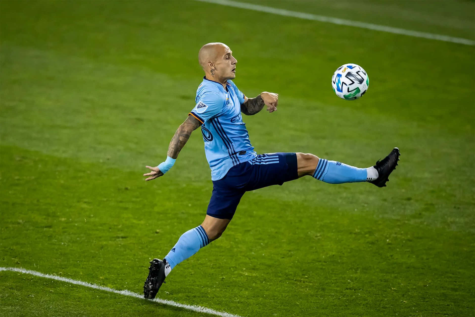 Soccer Player Mid Air Kick Background