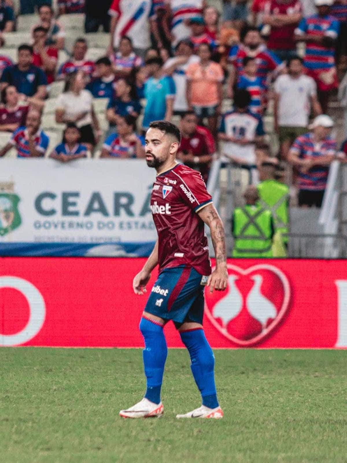 Soccer Player On Field During Match Background