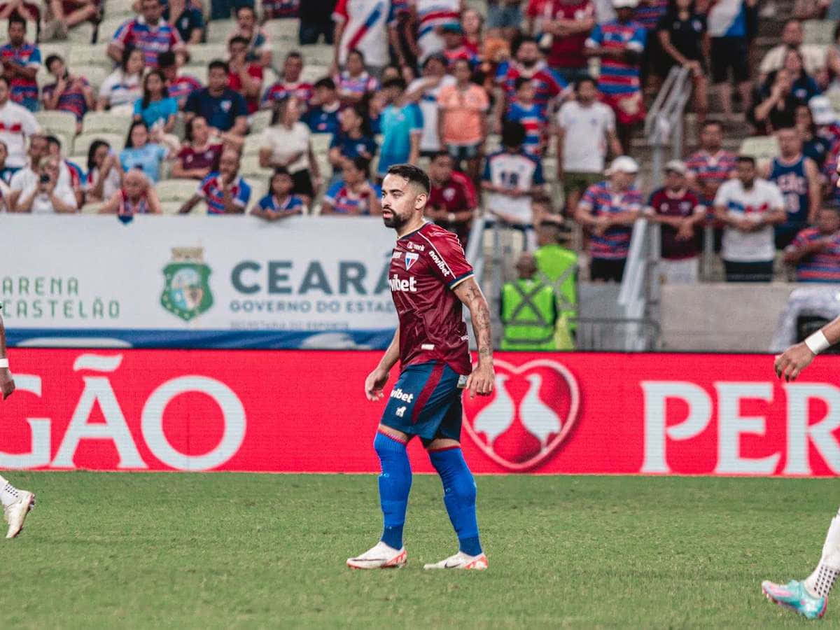 Soccer_ Player_on_ Field_ During_ Match.jpg Background