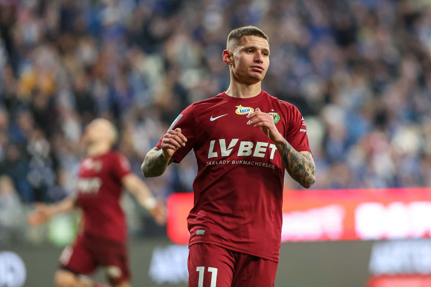 Soccer Player Patryk Klimala In Action Background