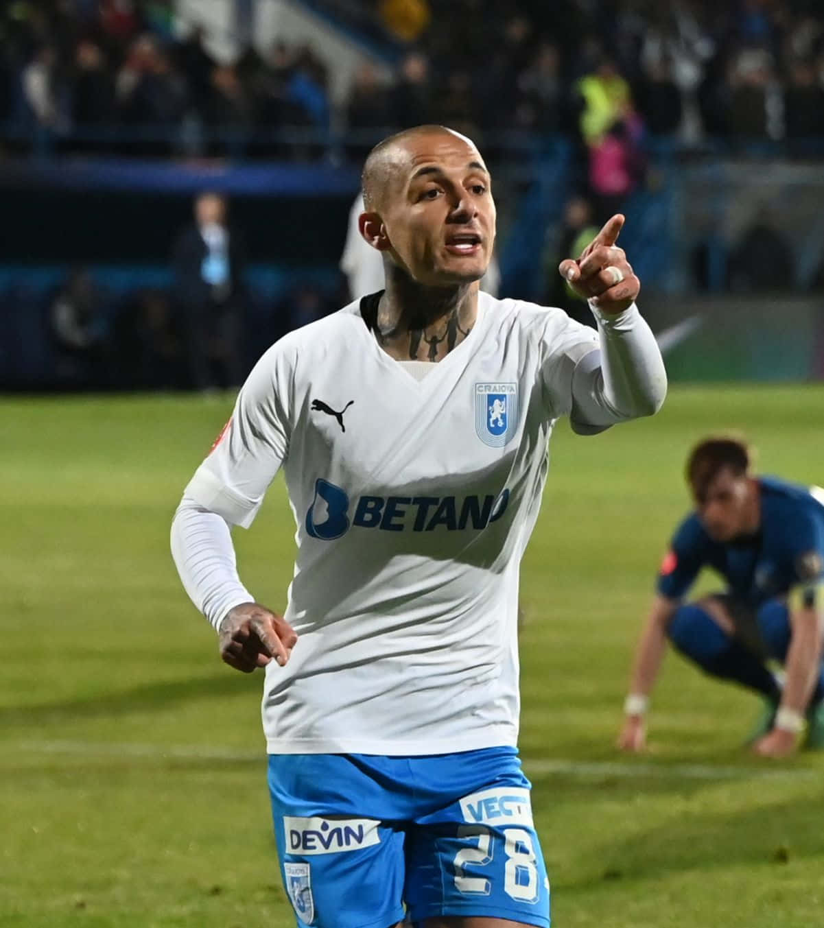 Soccer_ Player_ Pointing_ During_ Match Background