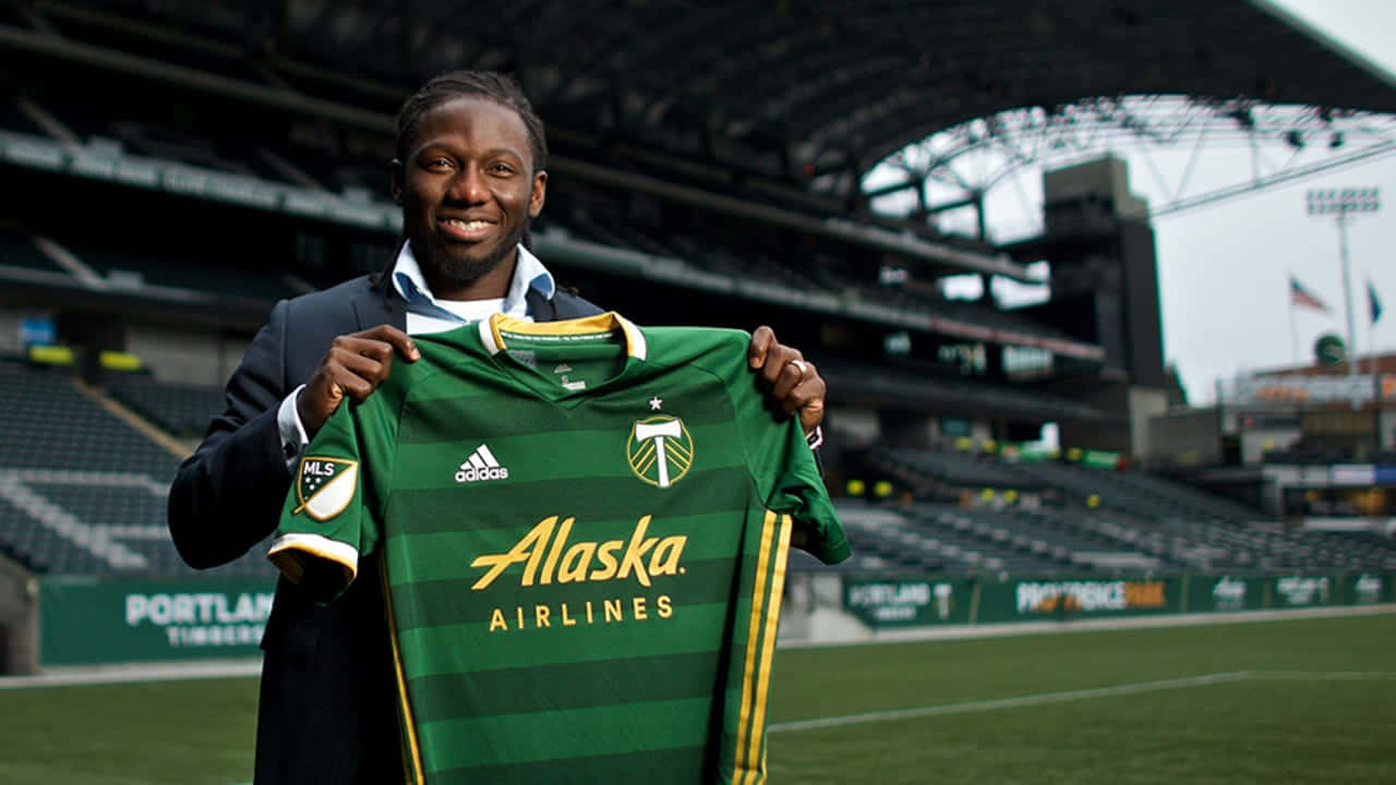 Soccer Player Presenting New Jersey Background