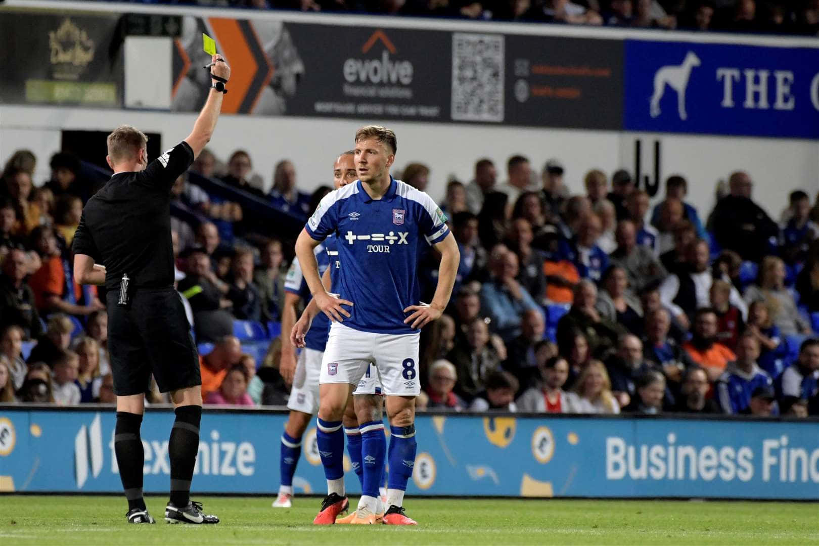 Soccer Player Receives Yellow Card Background