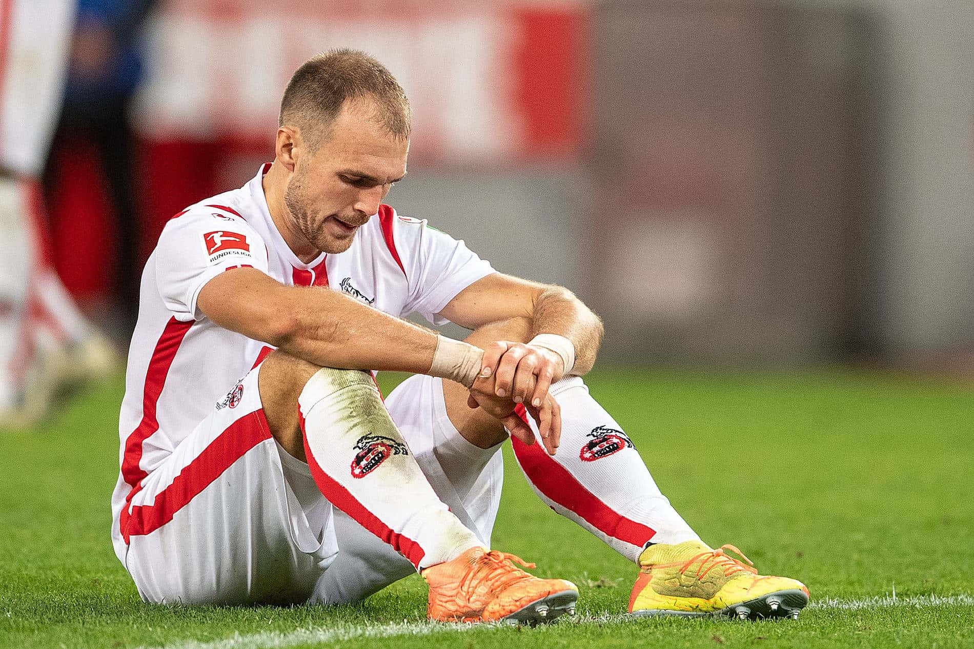 Soccer Player Reflecting After Match Background
