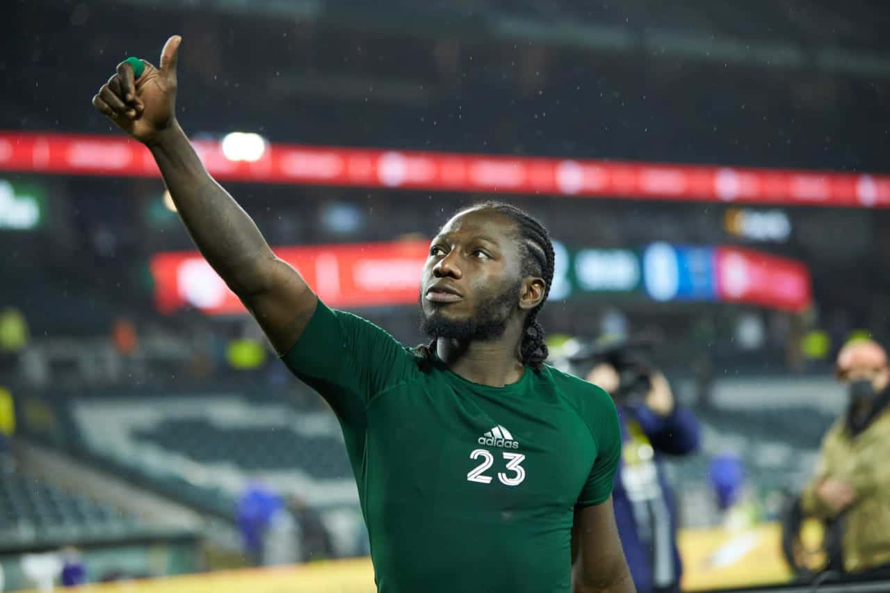 Soccer_ Player_ Thumbs_ Up_ Celebration Background