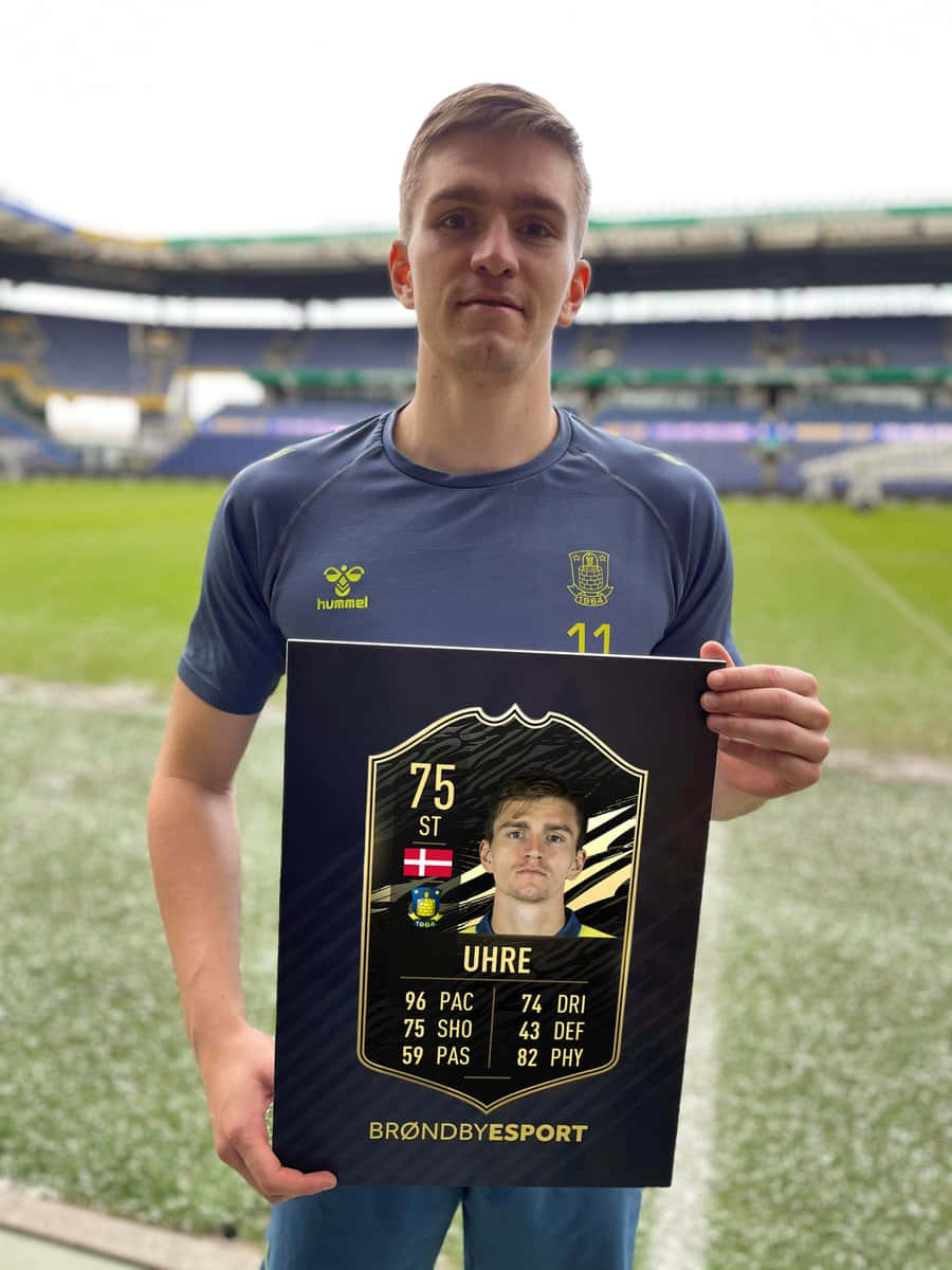 Soccer Player Uhre Holding F I F A Card Background