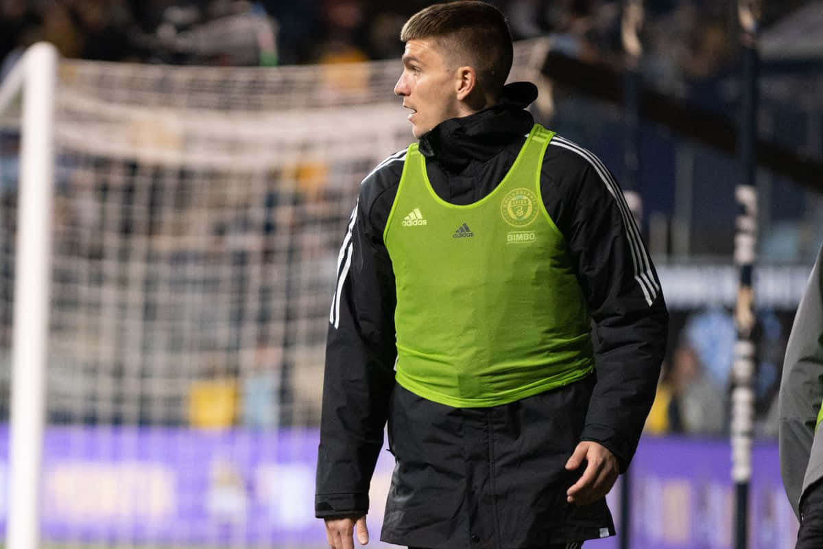 Soccer Player Warming Up Before Match Background