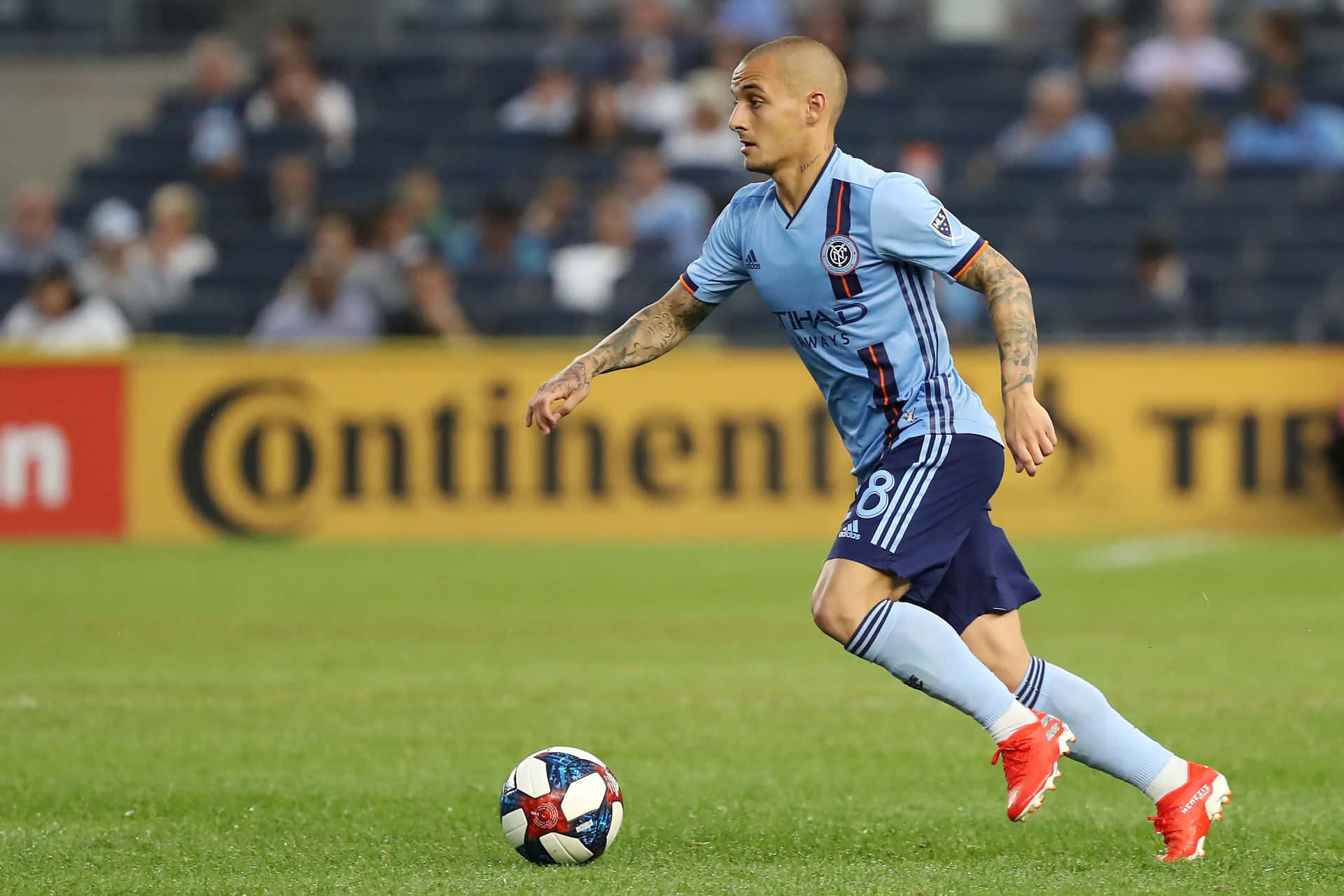 Soccer Playerin Action During Match Background