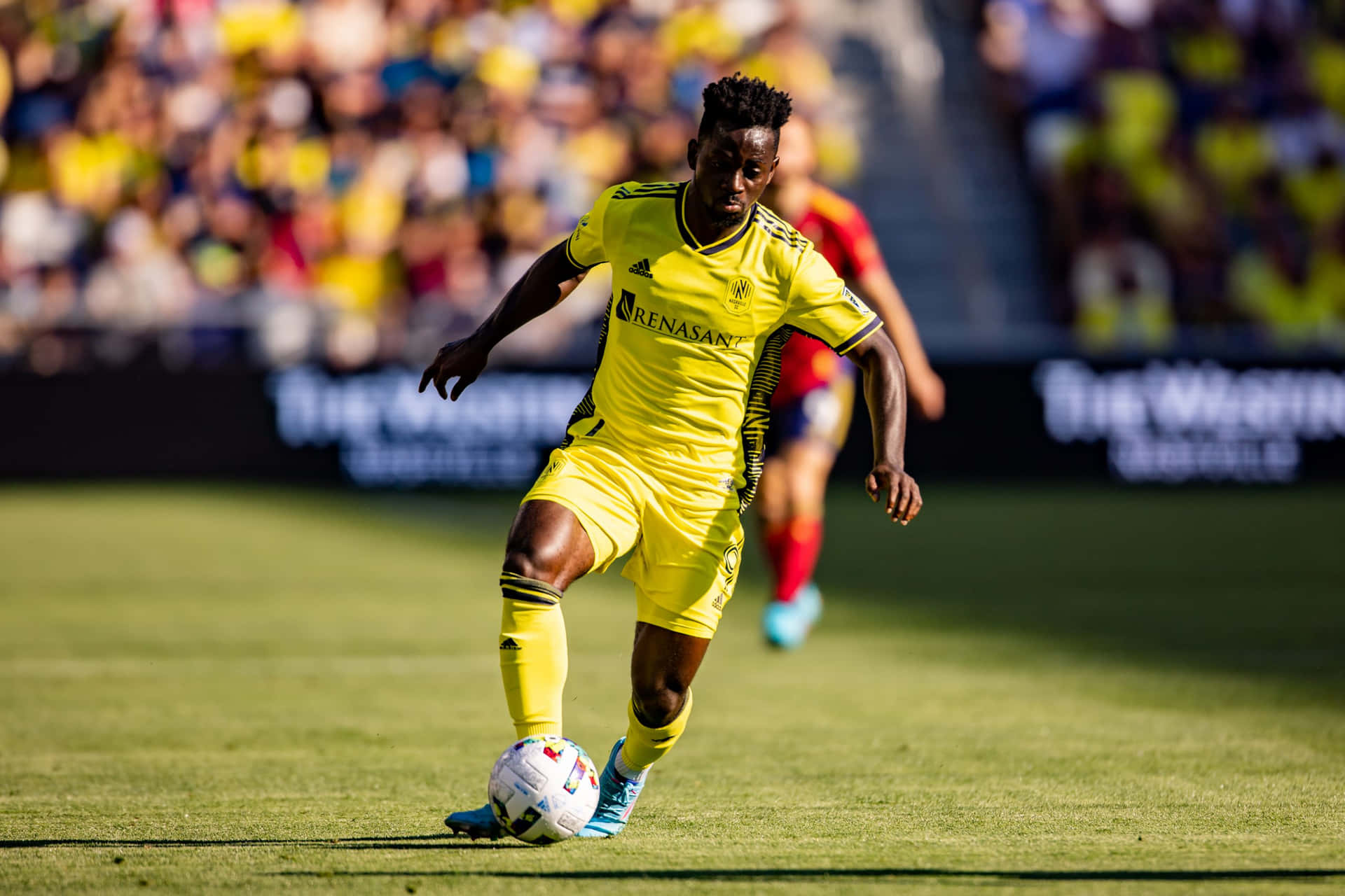 Soccer Playerin Action During Match Background