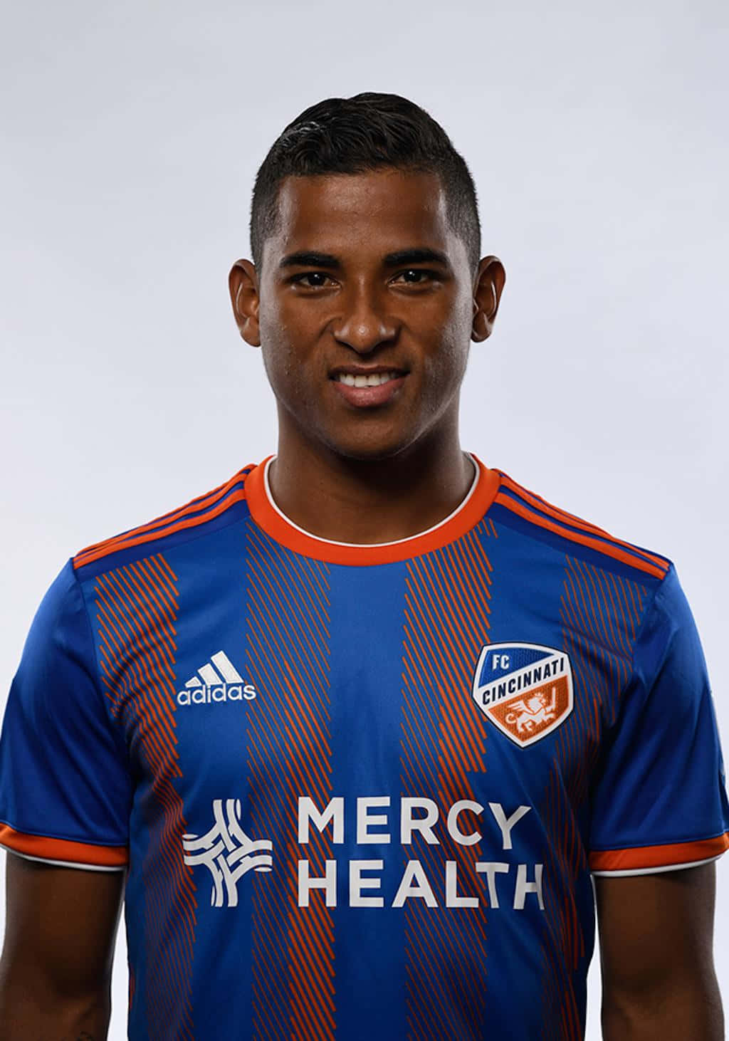 Soccer Playerin Blue Orange Kit Background