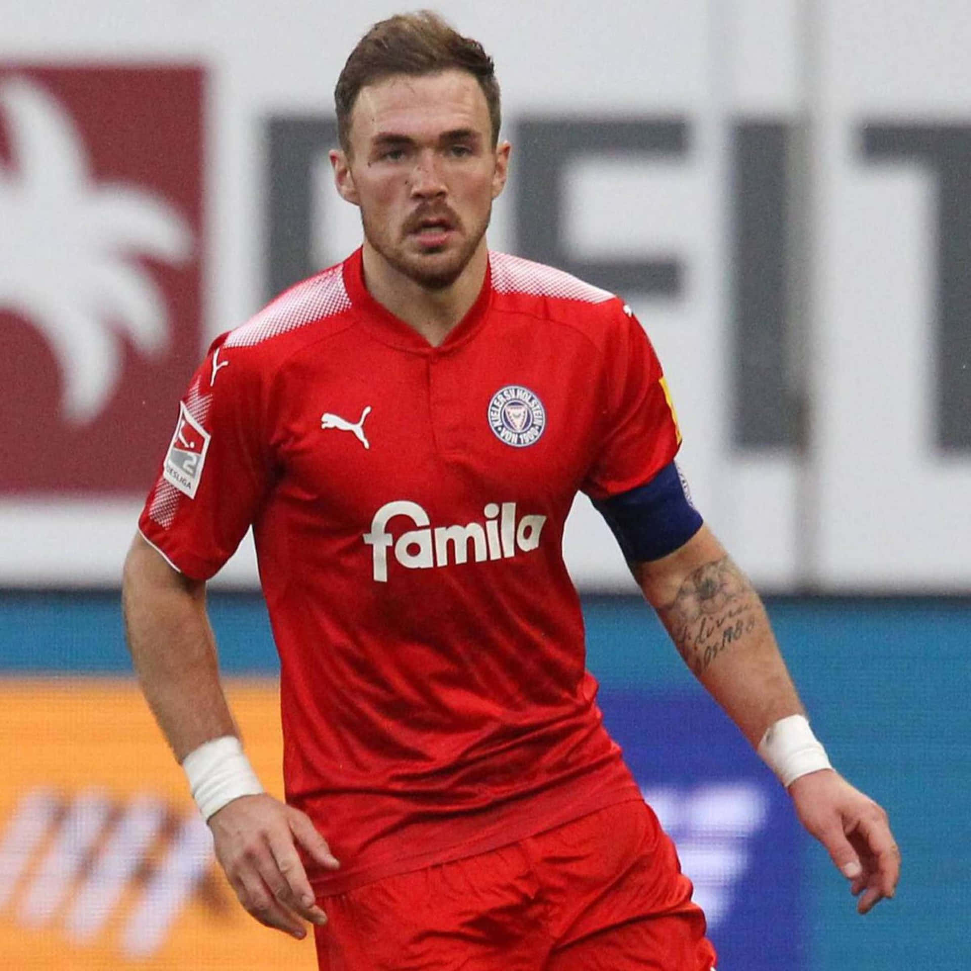 Soccer Playerin Red Kit Background