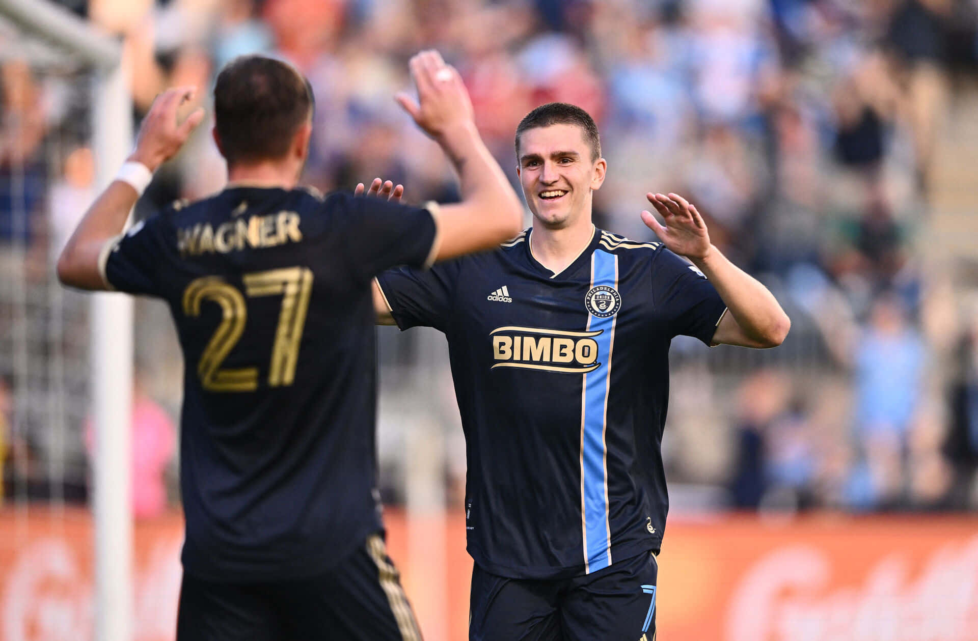 Soccer Players Celebrating Victory Background