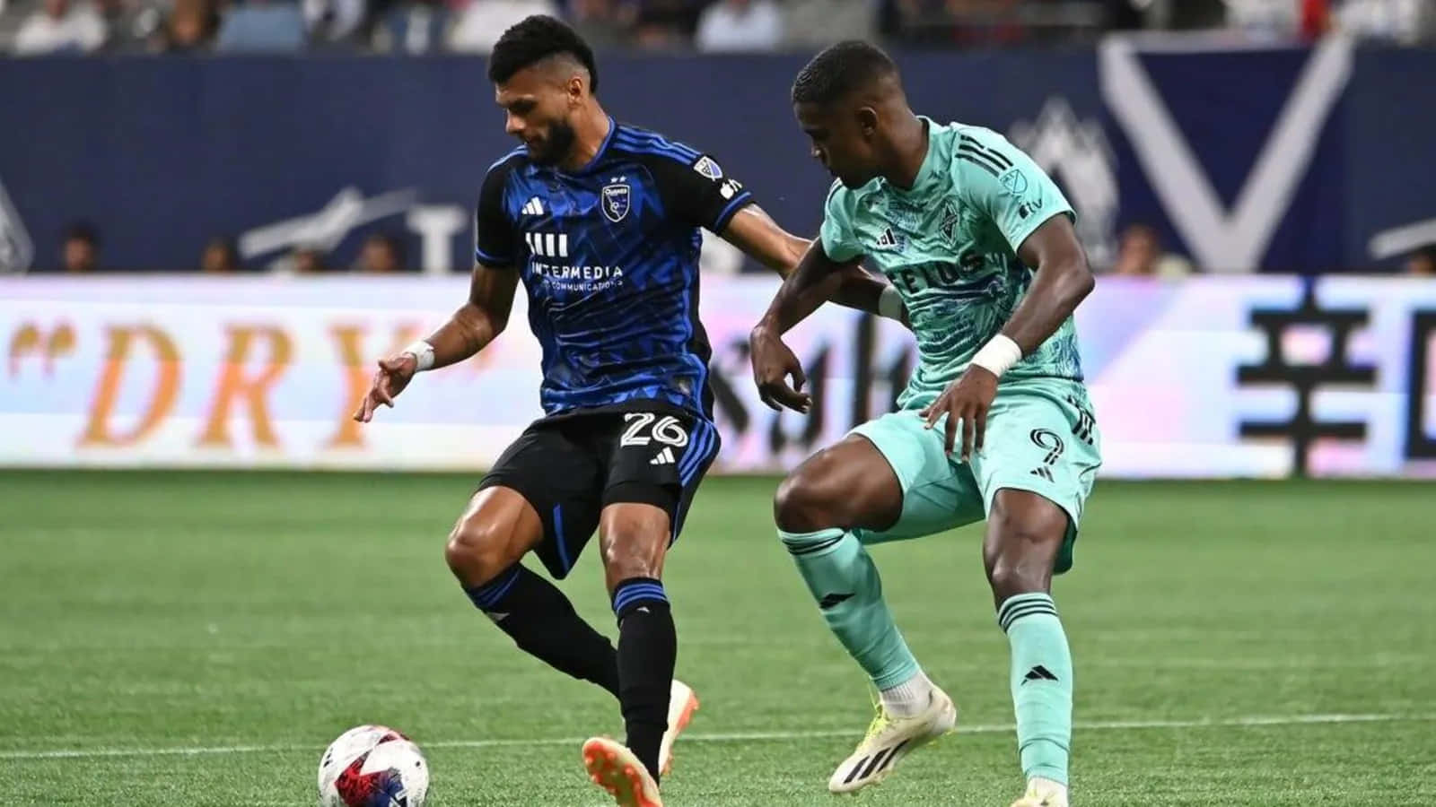 Soccer Players Competingon Field