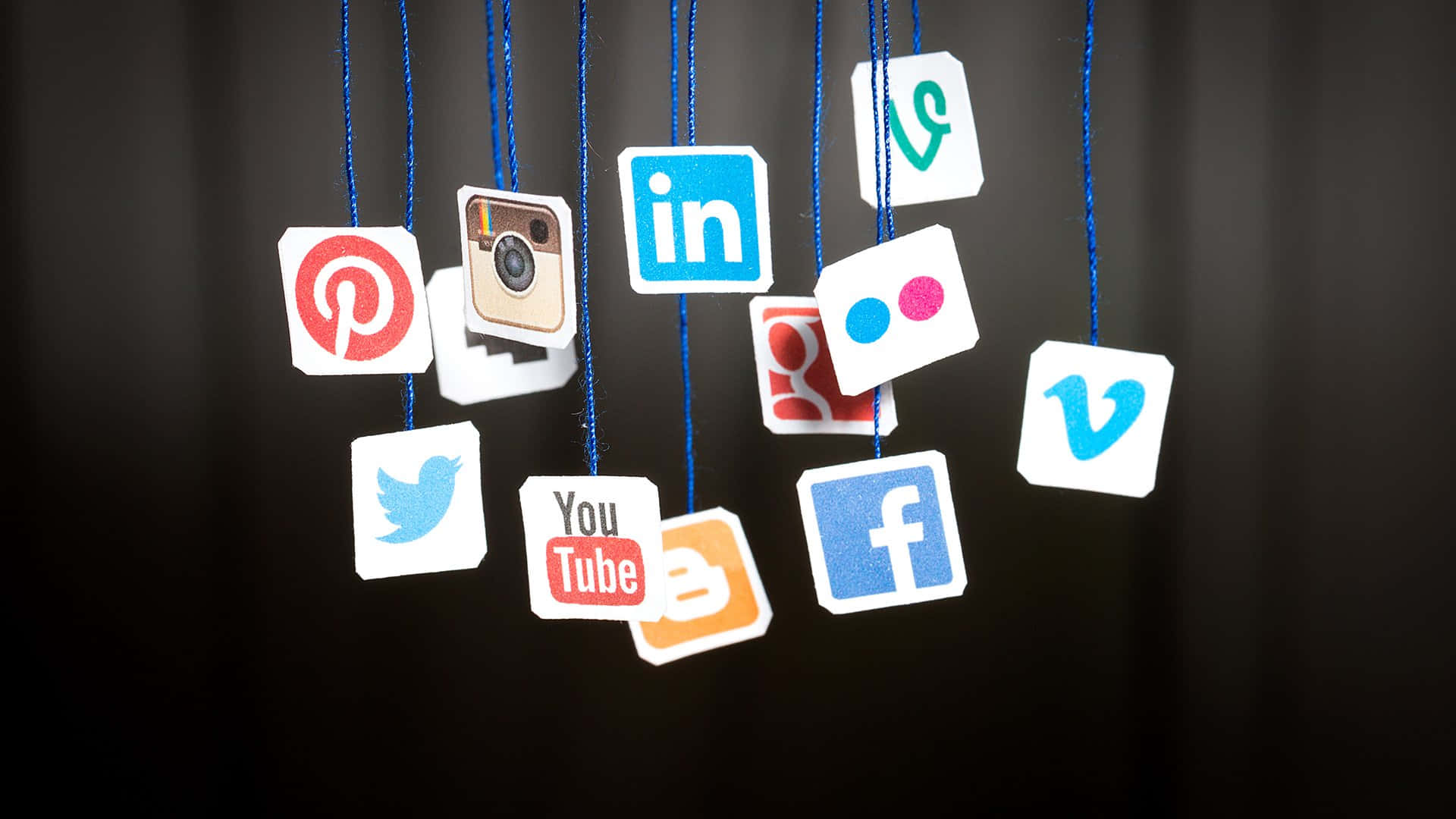 Social Media Icons Hanging From Strings