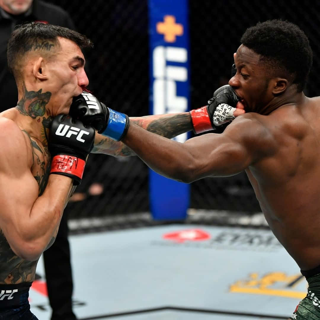 Sodiq Yusuff In Intense Match Against Andre Fili Background