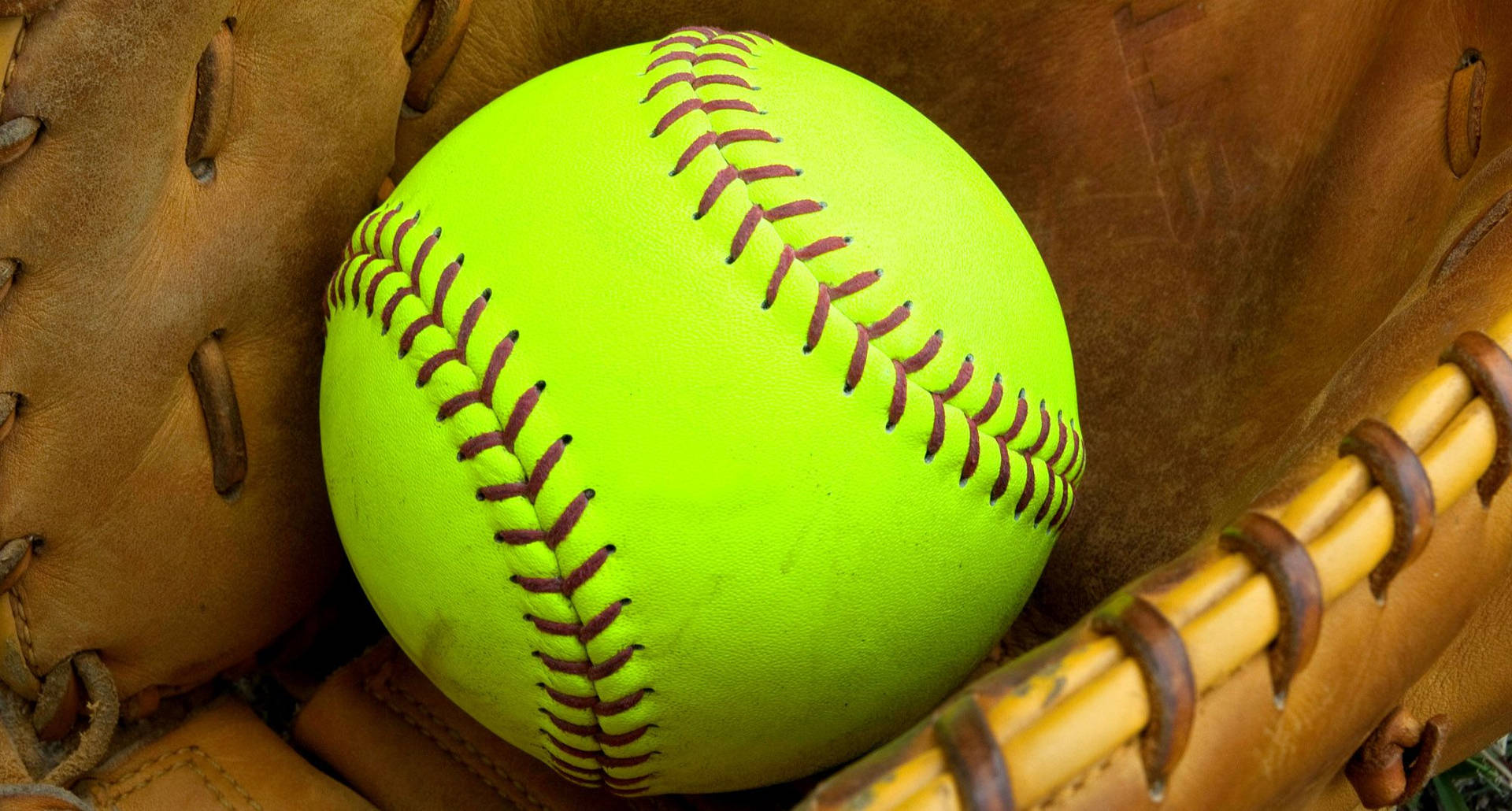 Softball Inside Of A Leather Mitts Background