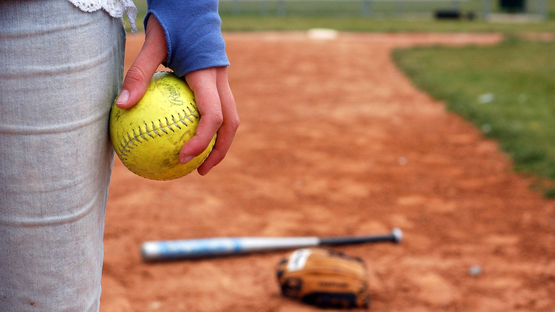 Softball Photograph On Hand Background