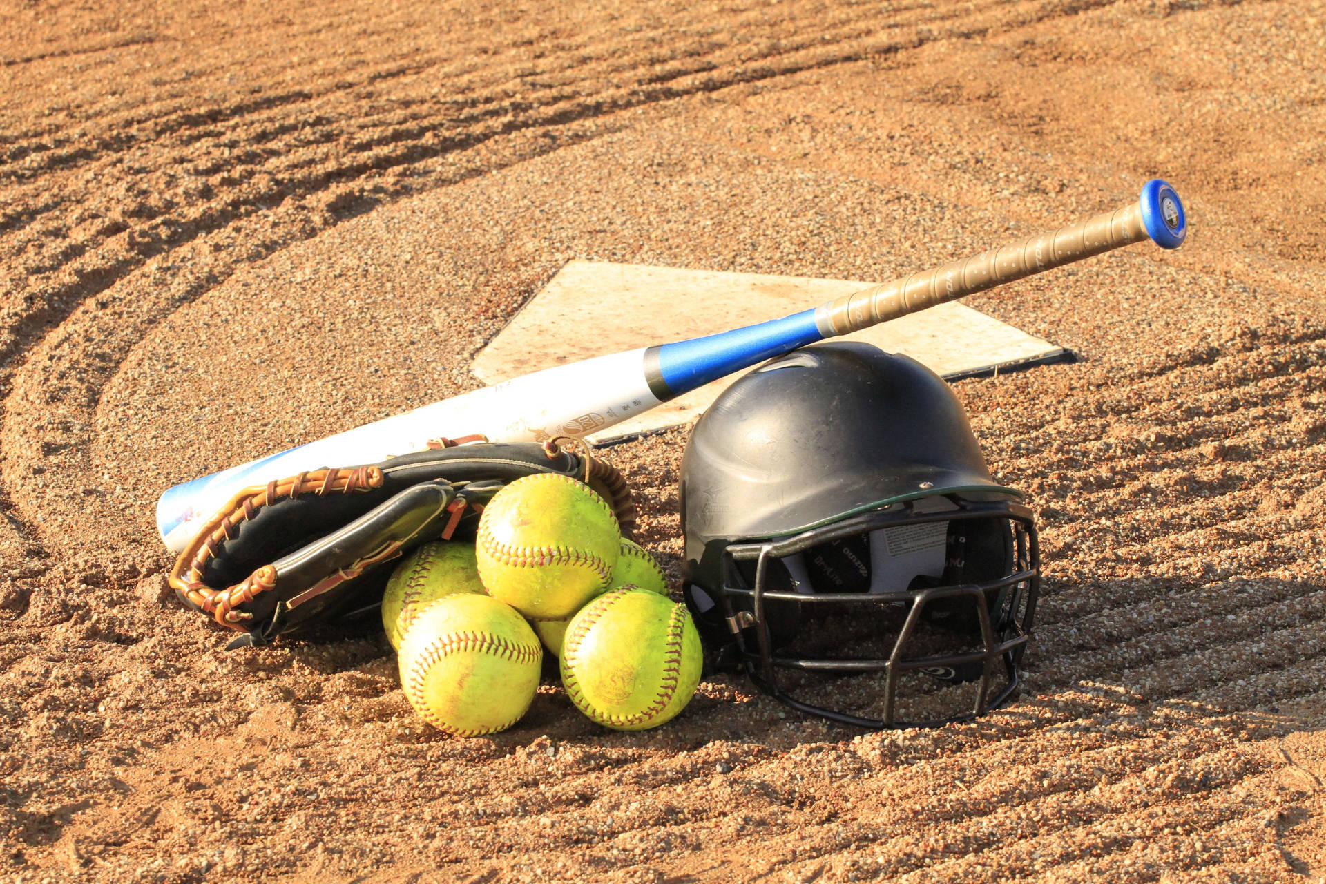 Softball Pile With Bat And Helmet