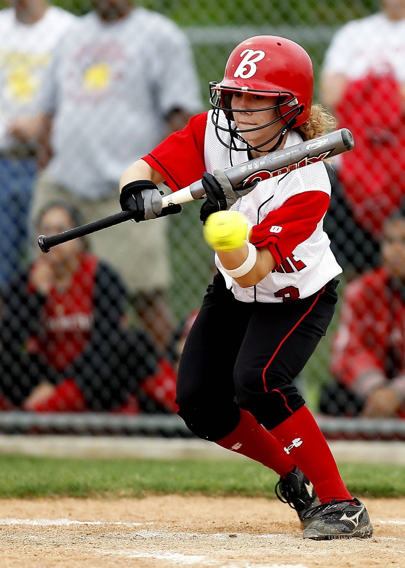 Softball Player With Fast Moving Ball