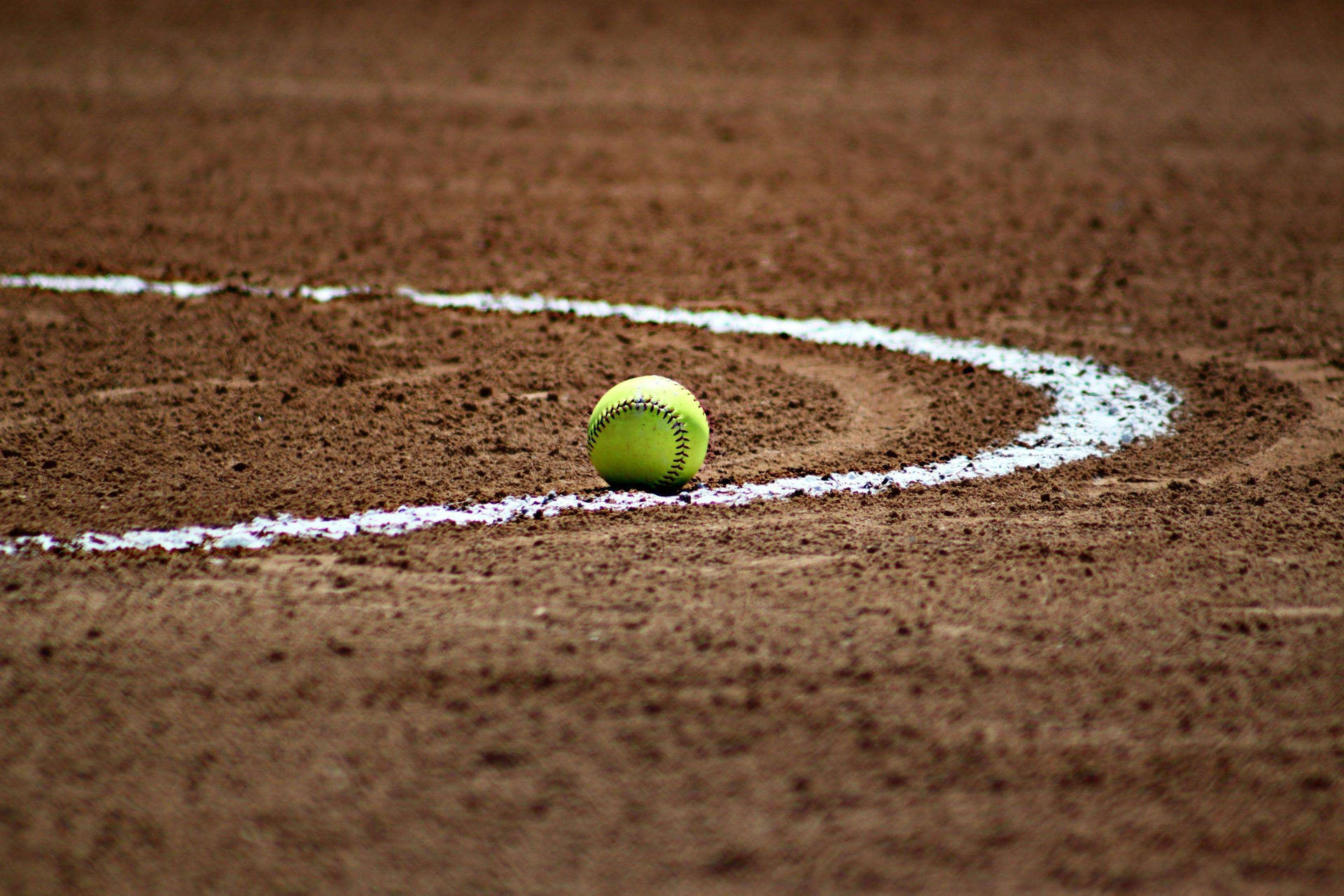 Softball Surrounded By White Curved Line Background