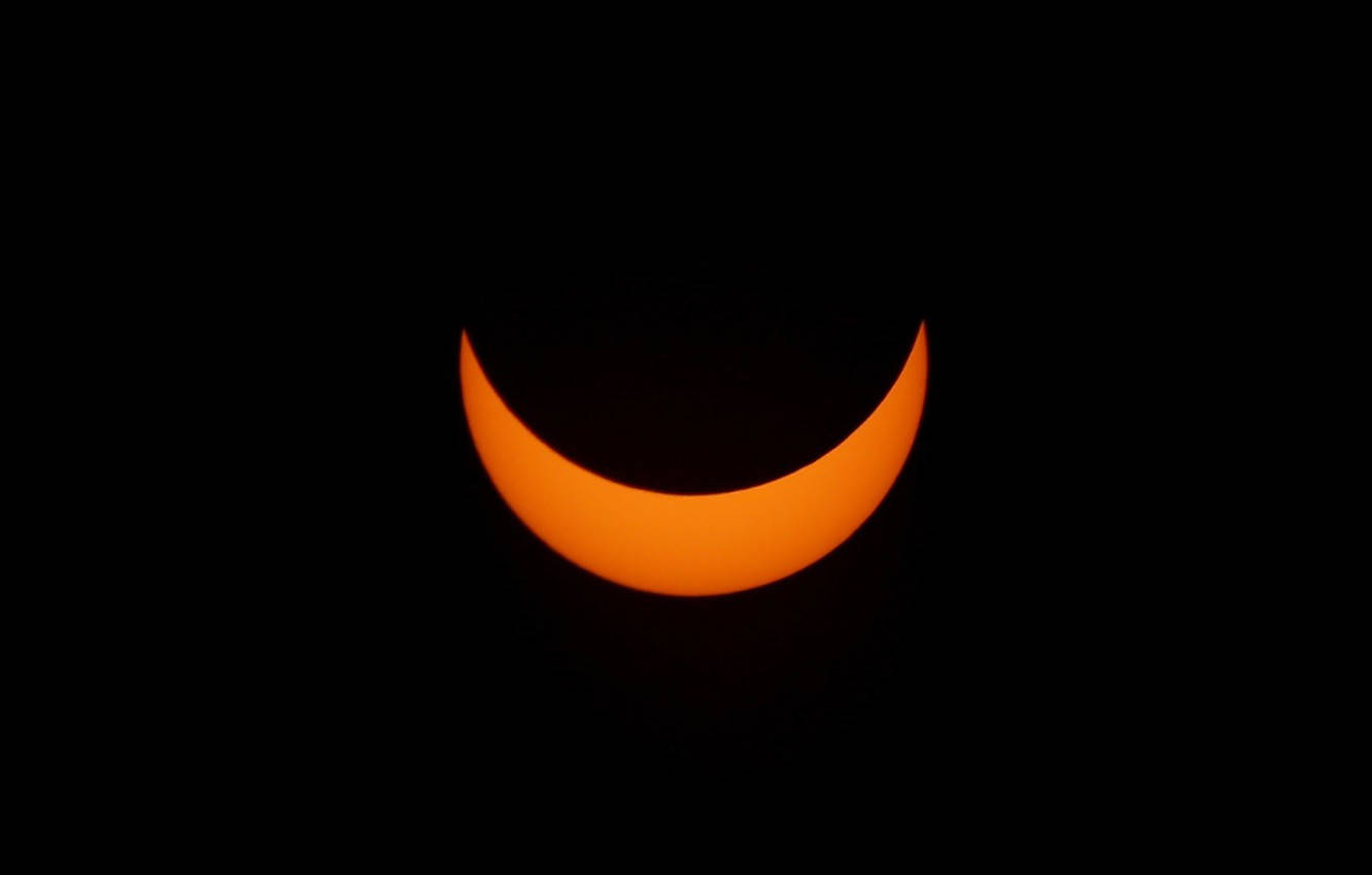 Solar Eclipse Crescent Background