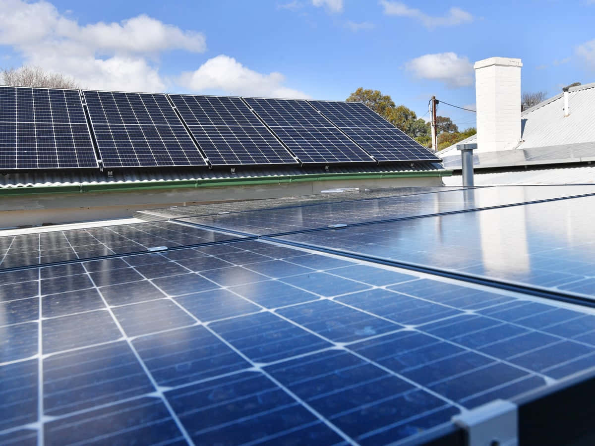 Solar Panels On A House Roof In Australia Background