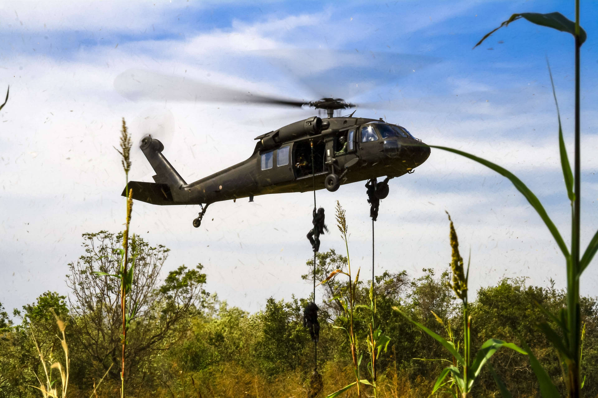 Soldiers From Black Hawk Helicopter Background