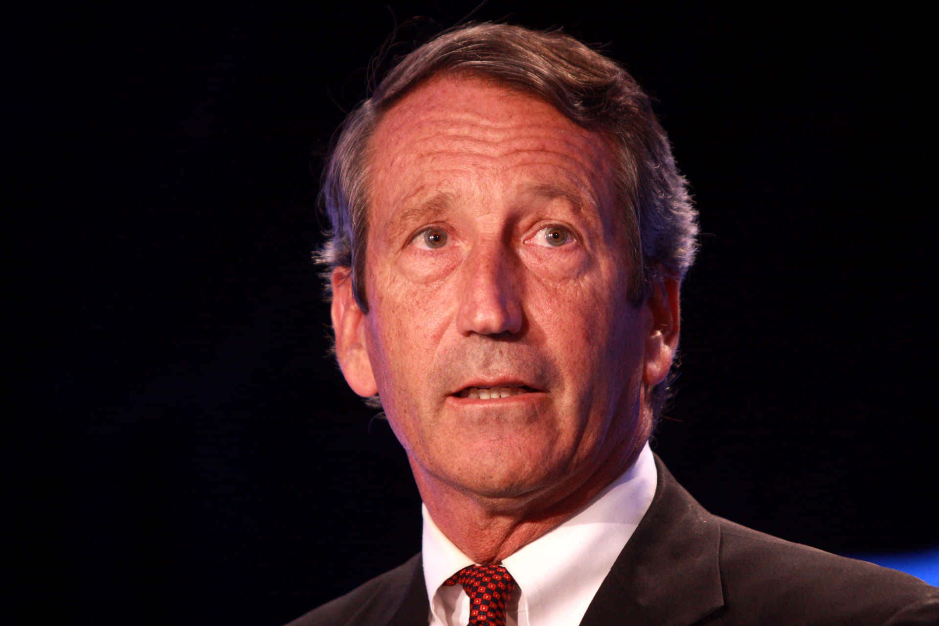 Solemn Mark Sanford Background