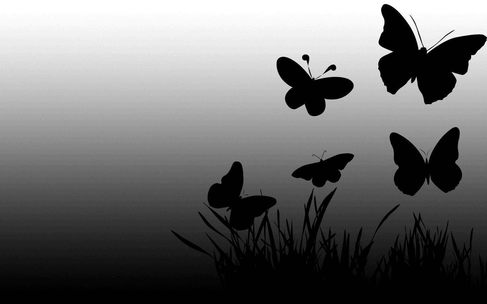 Solid Black Butterfly Graphics With Grass Background